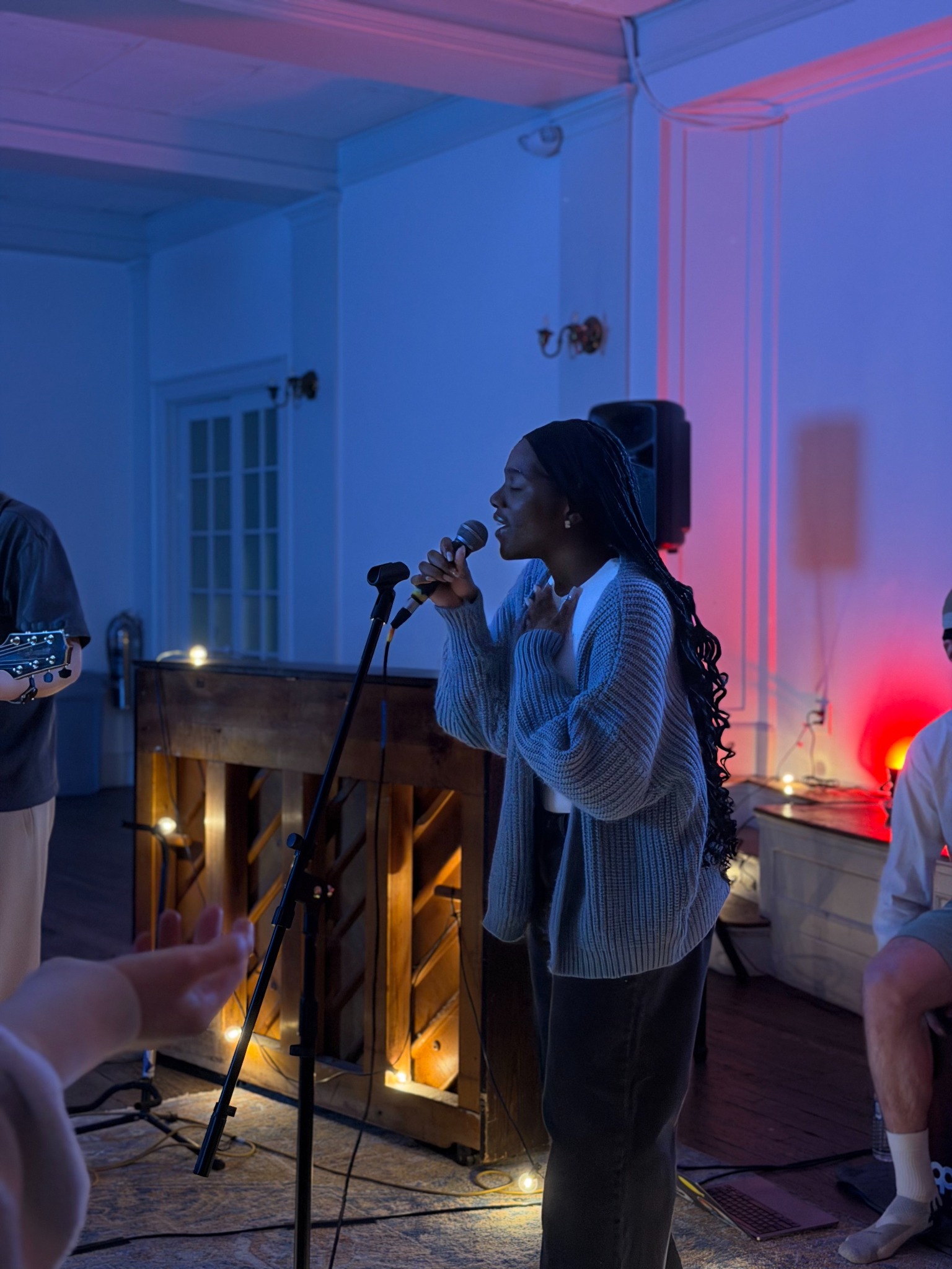 Awele singing during a Yadah worship gathering